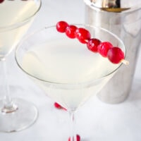 Winter White Cosmo - a fun seasonal twist on the classic Cosmopolitan cocktail. Fruity, tart, slightly sweet and delicious. Great for your holiday parties!
