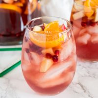 Christmas Sangria Recipe - This fun white wine sangria and all full of fall and winter flavors. It is perfect for Christmas and all your winter get togethers!
